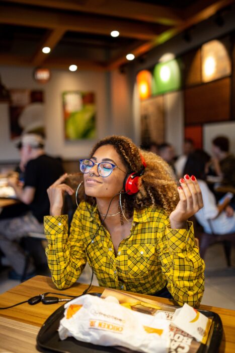 girl listening to motivational podcasts