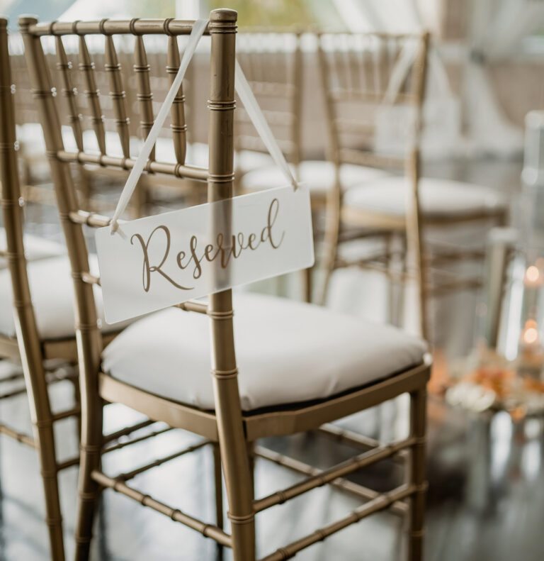 reserved sign on seat at wedding ceremony