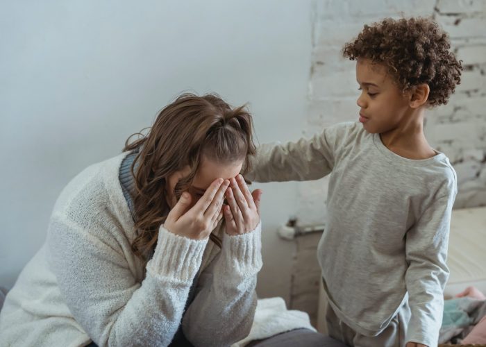 son consoling sad mom